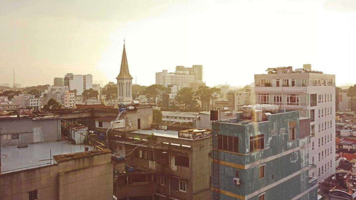 Dense city skyline at golden hour representing global urbanization and cities as the frontline of change