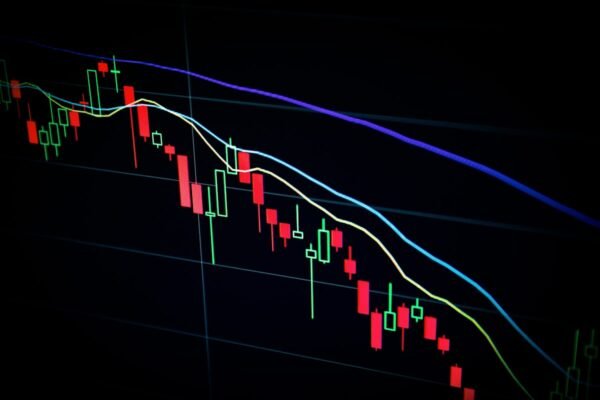 Stock market candlestick chart with red and green price movements representing financial market news