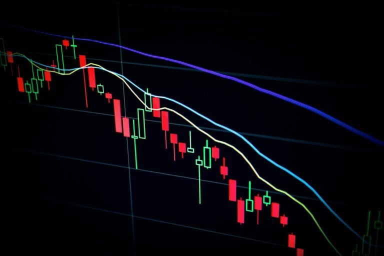 Stock market candlestick chart with red and green price movements representing financial market news