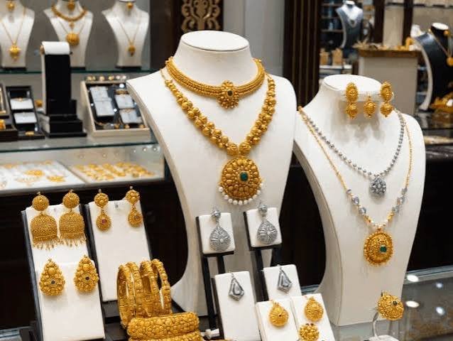 Today gold rate reflected in gold necklaces and jewellery displayed in a retail jewellery shop