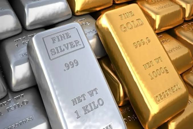 Today gold and silver rate shown on stacked fine gold 999.9 and fine silver 999 bullion bars