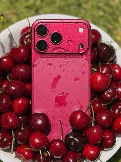 Pink iPhone 18 Pro Max case surrounded by fresh cherries