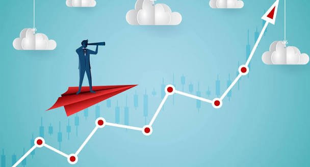 Businessperson on a paper plane looking ahead over a rising chart representing spotting growth trends